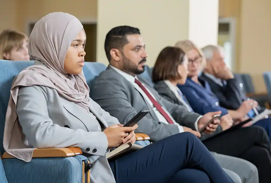 Interprefy - Government - Ai Speech Translation - Person using AI Translation on phone