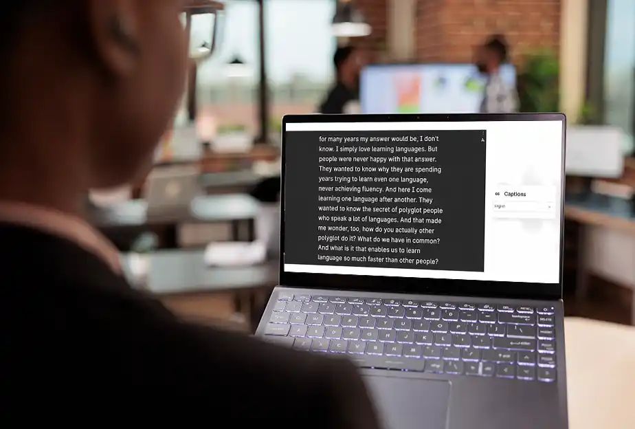 Interprefy - Educational Institutions - Live Captions - Man in front of laptop